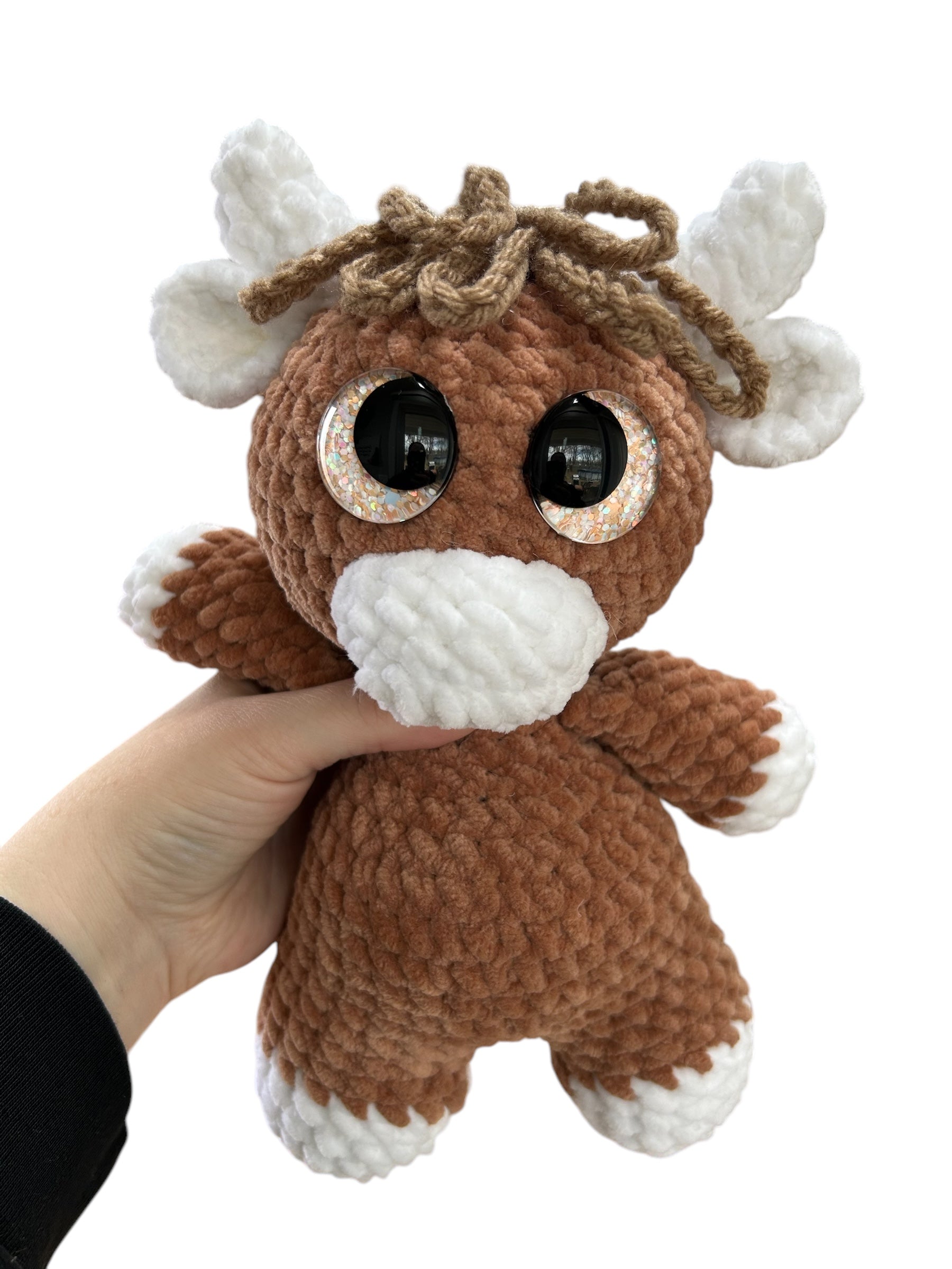 Hand crocheted Highland Cow Plushies in a variety of colors
