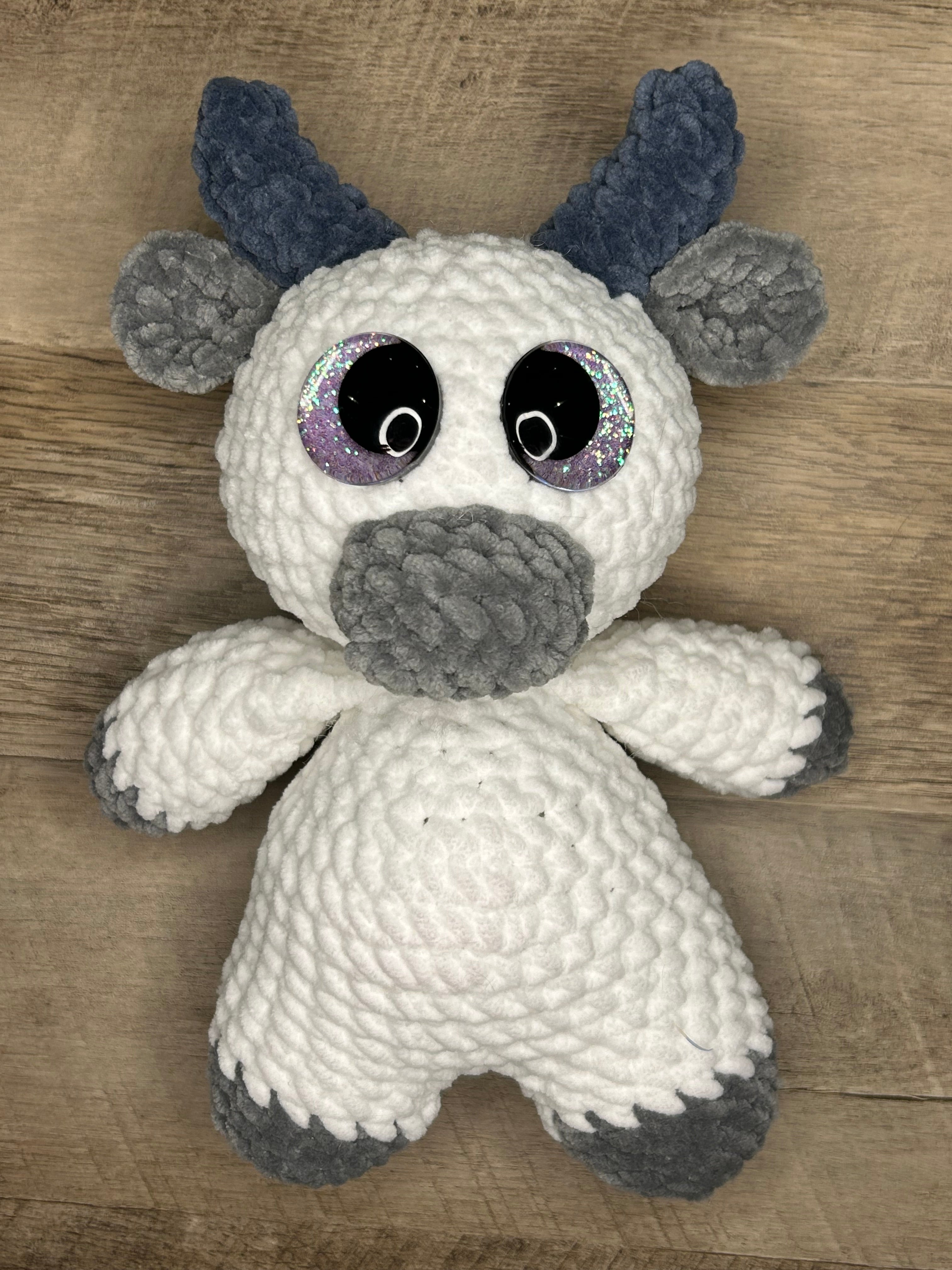 Hand crocheted Highland Cow Plushies in a variety of colors
