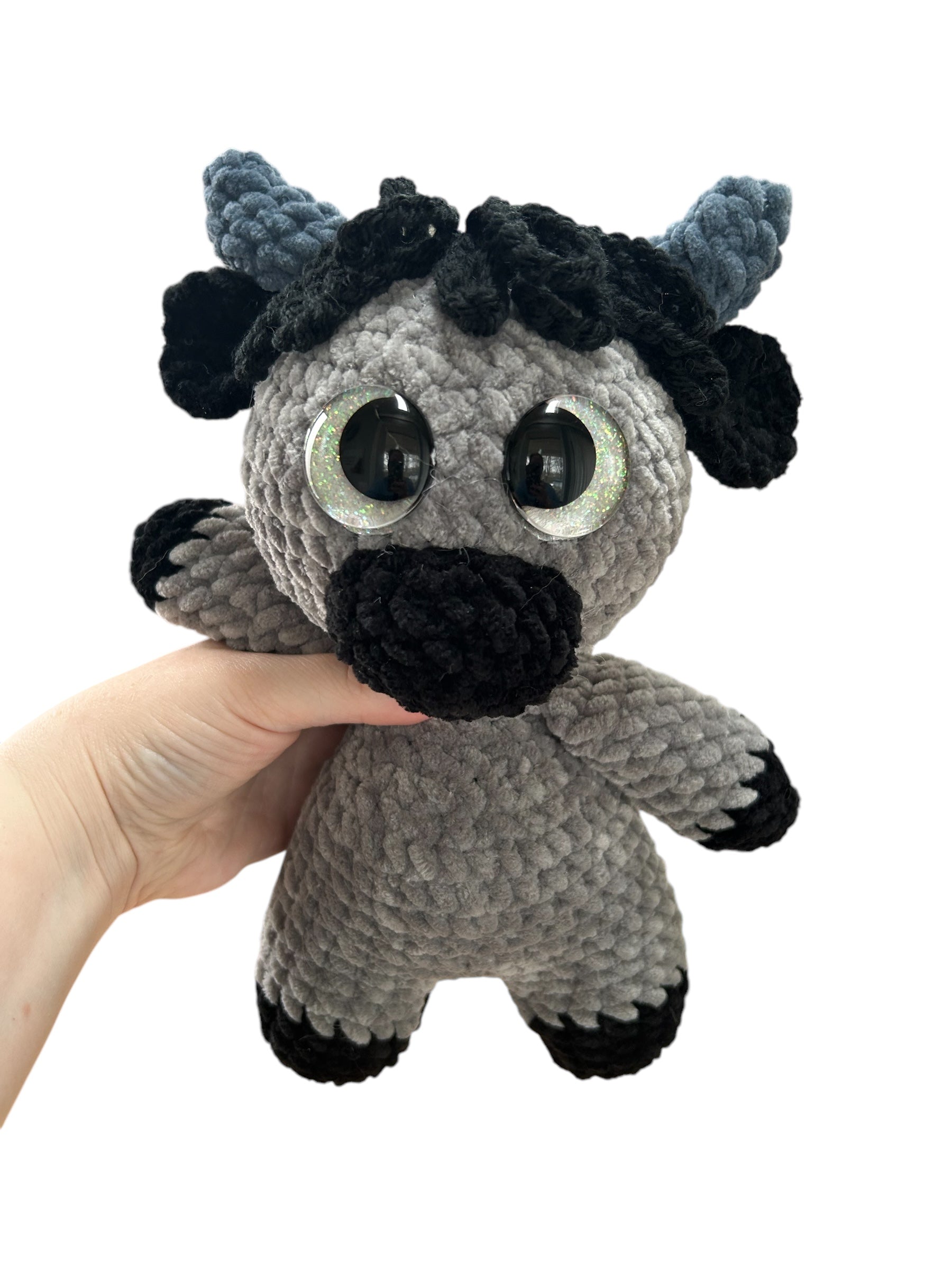 Hand crocheted Highland Cow Plushies in a variety of colors